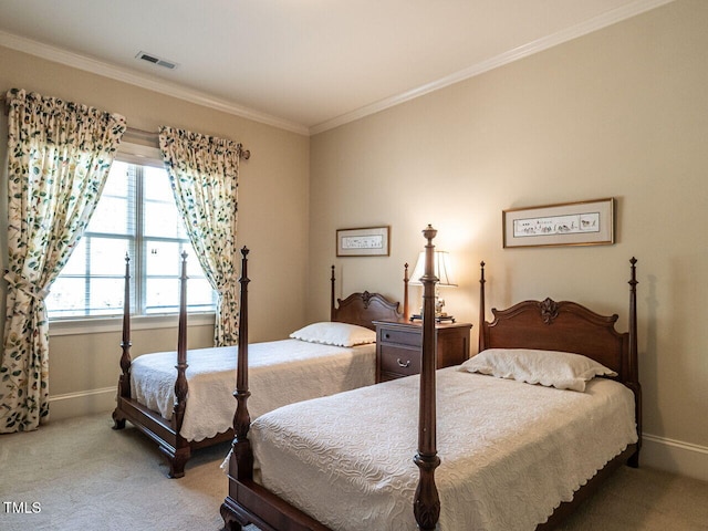 bedroom with ornamental molding, carpet flooring, visible vents, and baseboards