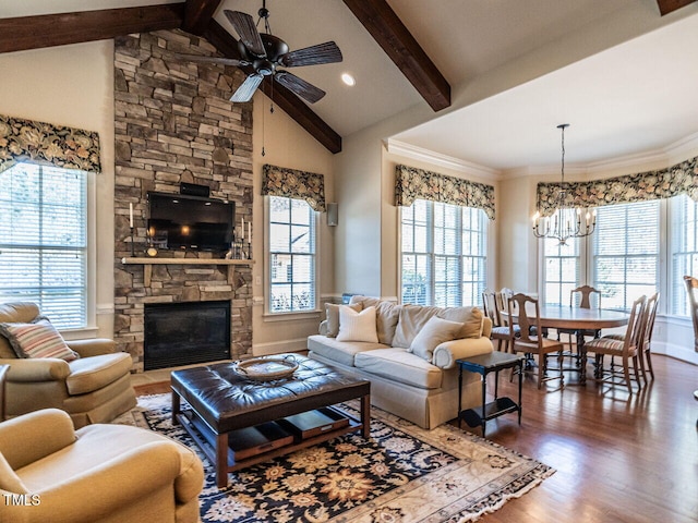 living area featuring high vaulted ceiling, a fireplace, wood finished floors, and beam ceiling