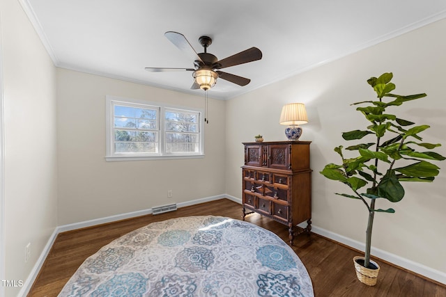 sitting room featuring visible vents, baseboards, and wood finished floors