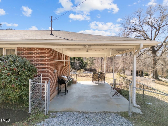 view of patio with fence and area for grilling