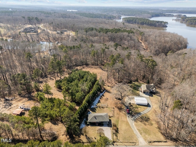 drone / aerial view featuring a water view and a view of trees