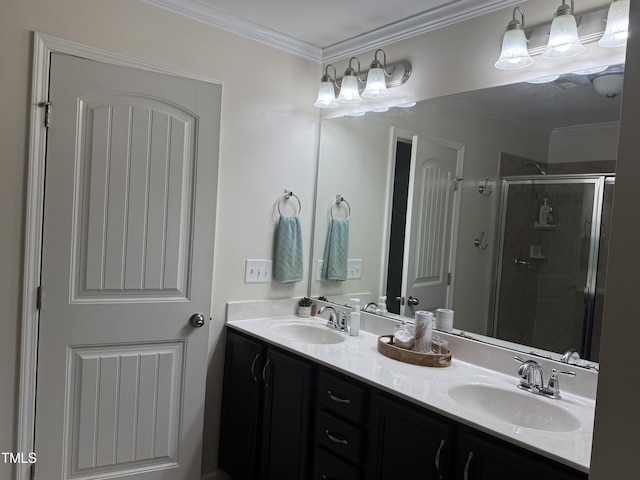 bathroom featuring ornamental molding, a stall shower, and a sink