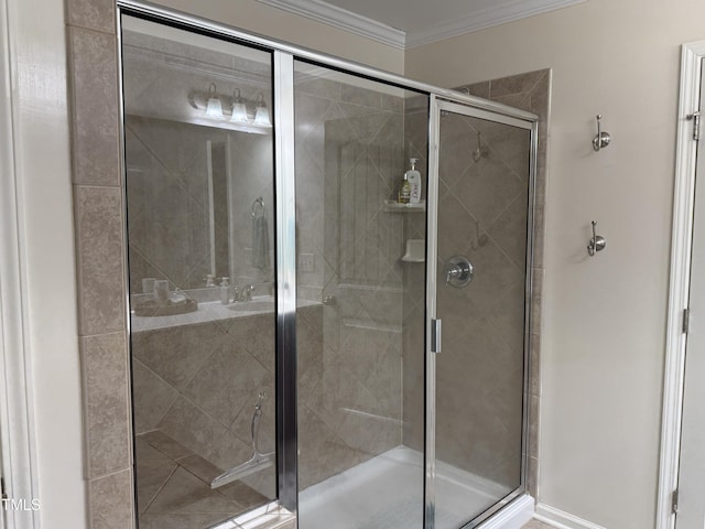 full bathroom with a stall shower and crown molding