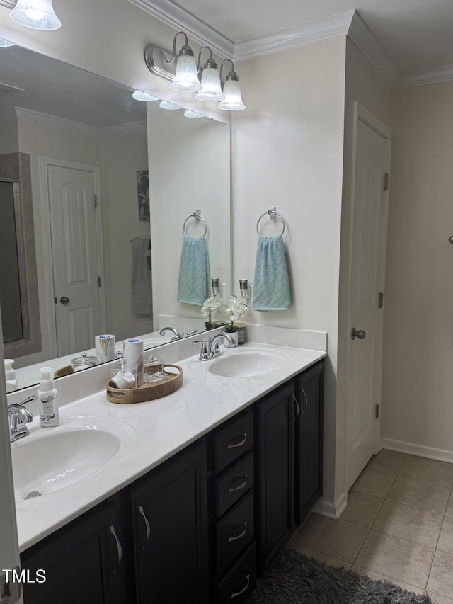 bathroom with ornamental molding, double vanity, a sink, and tile patterned floors