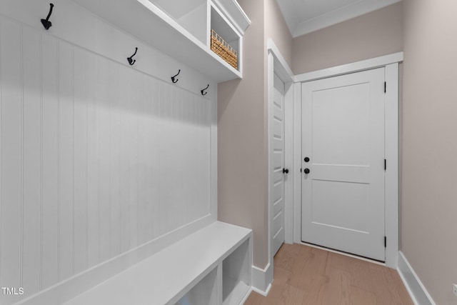 mudroom with light wood-type flooring and baseboards