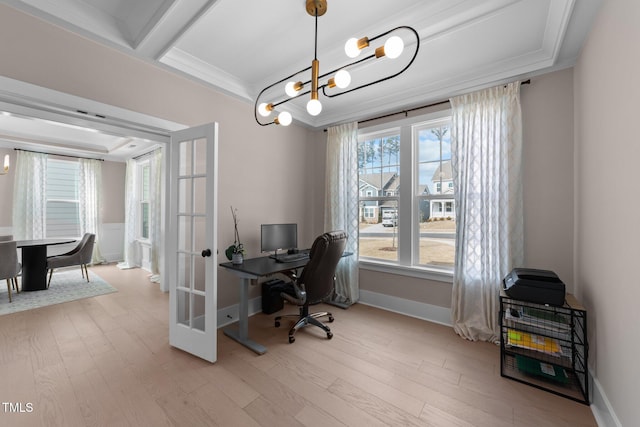 office area with light wood finished floors, a chandelier, ornamental molding, and french doors