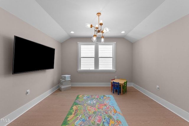 game room with lofted ceiling, light wood-style flooring, and baseboards