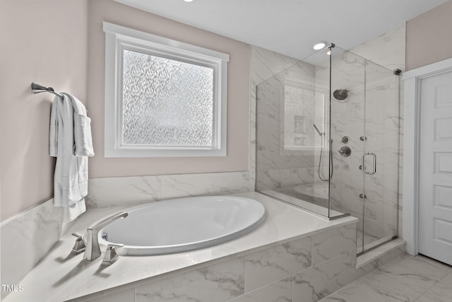 bathroom featuring marble finish floor, a garden tub, and a marble finish shower