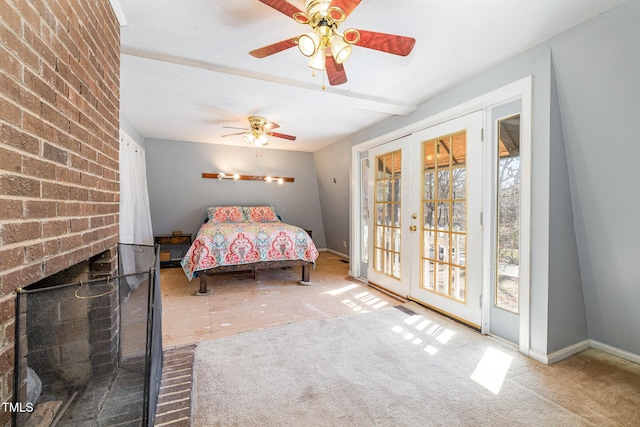 unfurnished bedroom with access to outside, a fireplace, baseboards, and french doors