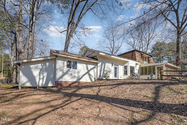 back of property featuring a sunroom