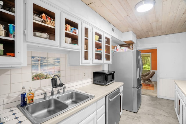 214 Woodcrest Ave, Smithfield, NC 27577 - kitchen with a sink, stainless steel appliances, light countertops, white cabinetry, and wooden ceiling