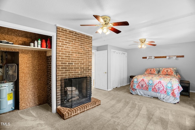 214 Woodcrest Ave, Smithfield, NC 27577 - bedroom with electric water heater, carpet floors, and a brick fireplace