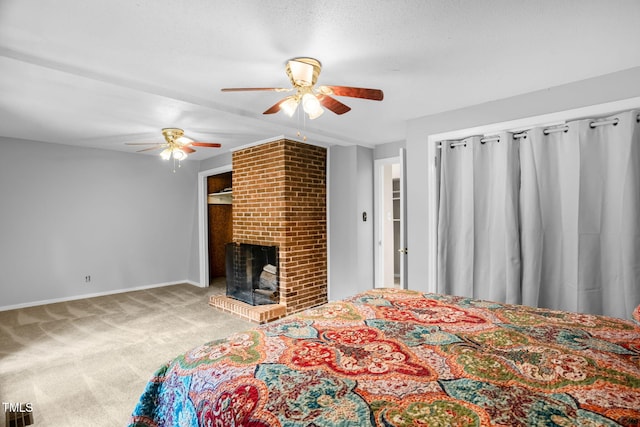 214 Woodcrest Ave, Smithfield, NC 27577 - bedroom with carpet floors, a brick fireplace, a ceiling fan, and baseboards