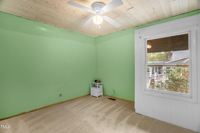 214 Woodcrest Ave, Smithfield, NC 27577 - unfurnished room with carpet, wooden ceiling, a ceiling fan, and baseboards