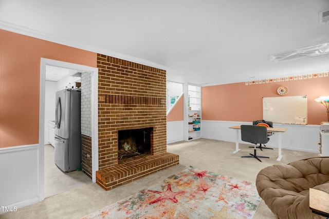 214 Woodcrest Ave, Smithfield, NC 27577 - living room featuring carpet floors, a desk, a fireplace, and crown molding