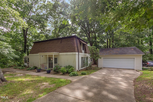 214 Woodcrest Ave, Smithfield, NC 27577 - view of front of house featuring a detached garage, an outbuilding, and mansard roof