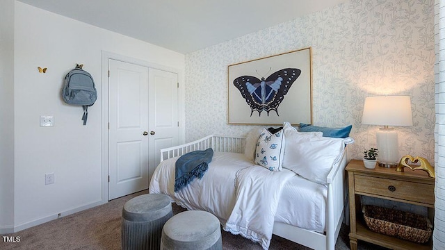 carpeted bedroom with baseboards, a closet, and wallpapered walls