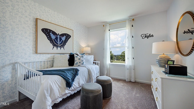 bedroom featuring wallpapered walls, baseboards, and carpet flooring