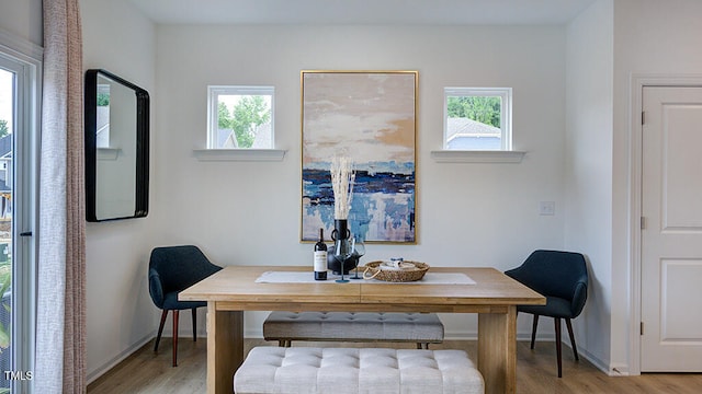 office featuring light wood-style floors and baseboards