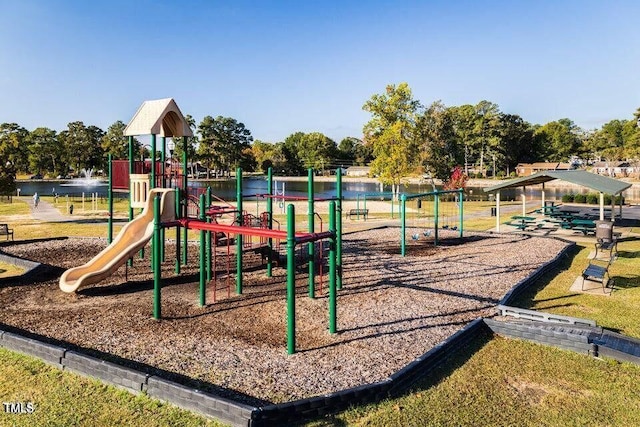 community jungle gym featuring a water view