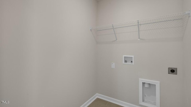 clothes washing area featuring baseboards, laundry area, hookup for a washing machine, and hookup for an electric dryer