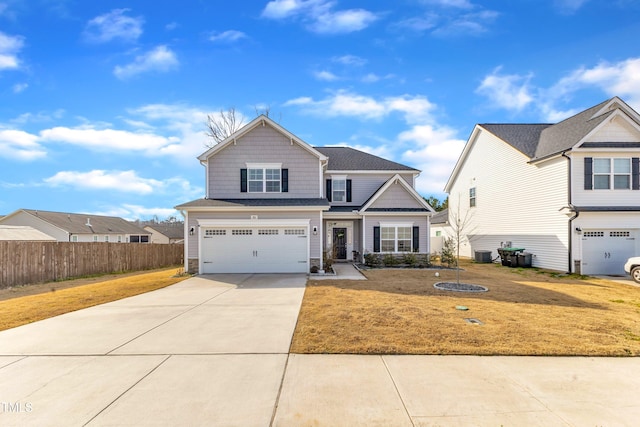 craftsman inspired home with a garage, concrete driveway, fence, cooling unit, and a front lawn