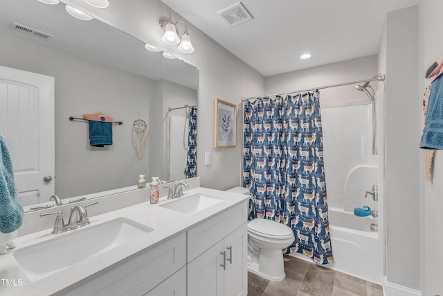 full bathroom featuring toilet, visible vents, and a sink