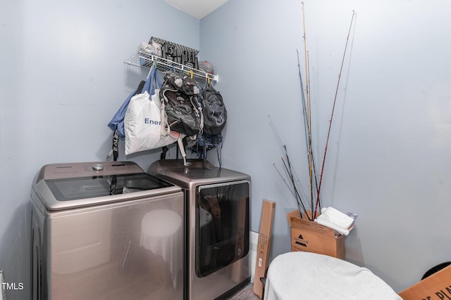 laundry room featuring laundry area and washing machine and clothes dryer