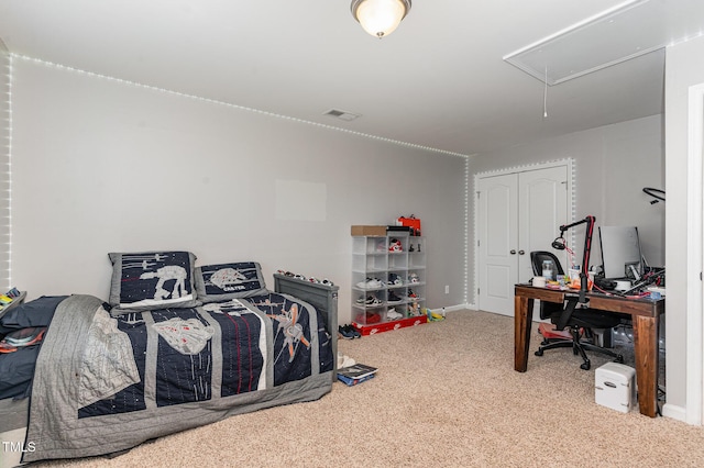 bedroom featuring carpet, attic access, visible vents, and a closet