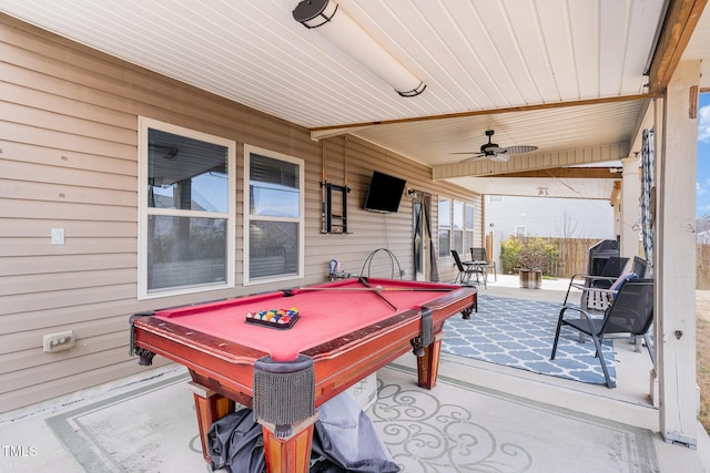 playroom with pool table, ceiling fan, and wooden walls