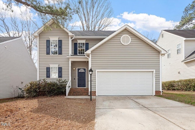 traditional-style home with driveway, an attached garage, and brick siding