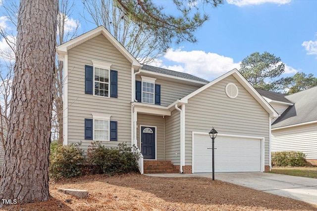 traditional-style home featuring driveway and an attached garage