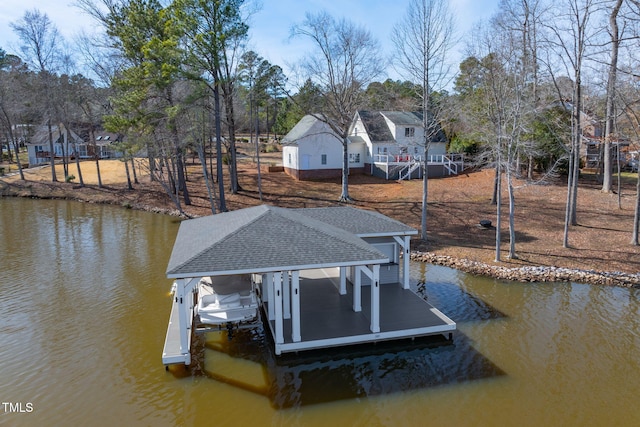 view of dock with a water view, boat lift, and a residential view