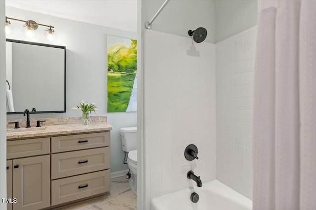 bathroom featuring toilet, marble finish floor, shower / bath combo, and vanity