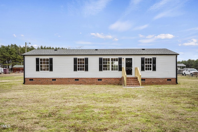 view of front of house with a shingled roof, a front yard, crawl space, and entry steps