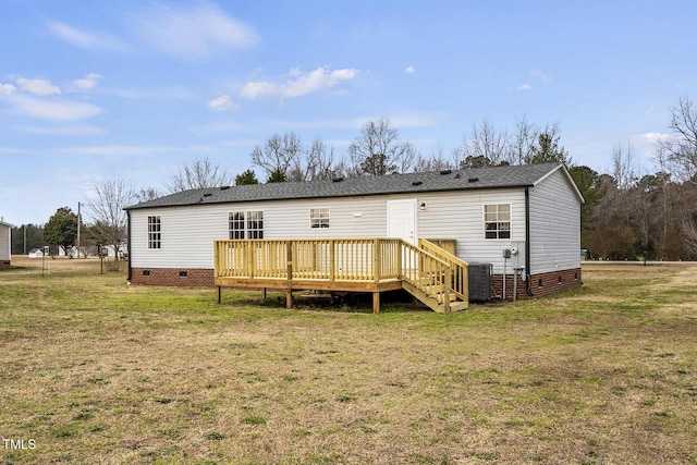 rear view of house with crawl space, a wooden deck, central AC unit, and a yard