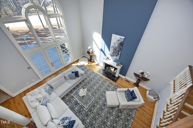 living room with baseboards and wood finished floors