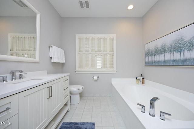 bathroom with a bath, visible vents, toilet, and vanity