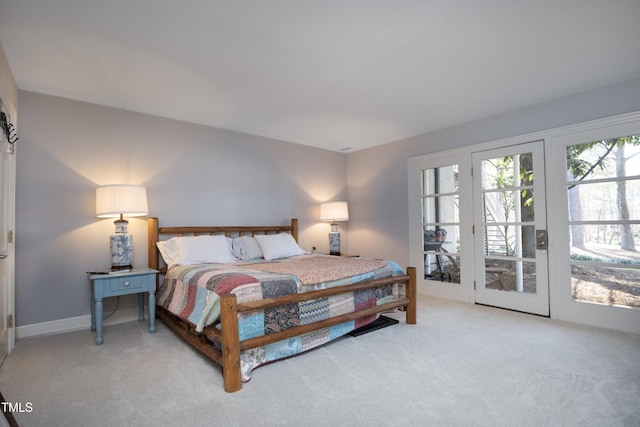 bedroom featuring access to exterior and carpet flooring