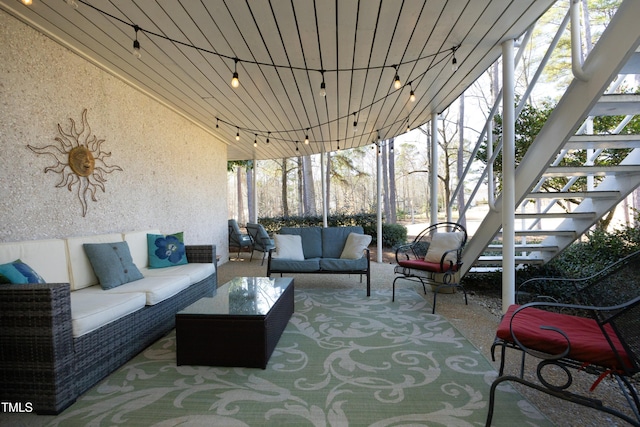 view of patio / terrace featuring stairway and an outdoor hangout area