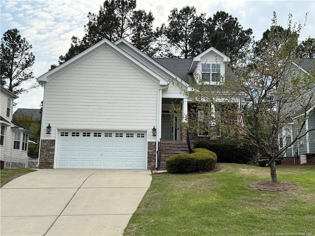 147 Lamplighter Way, Spring Lake, NC 28390 - view of front of house featuring driveway, a garage, stone siding, and a front lawn