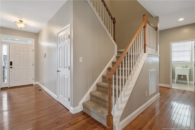 147 Lamplighter Way, Spring Lake, NC 28390 - entryway with visible vents, recessed lighting, wood-type flooring, stairs, and baseboards