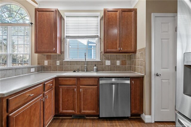 147 Lamplighter Way, Spring Lake, NC 28390 - kitchen with tasteful backsplash, appliances with stainless steel finishes, wood finished floors, and a sink