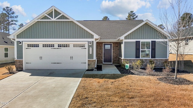 craftsman-style home featuring a garage, stone siding, board and batten siding, and concrete driveway