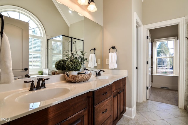 full bathroom with lofted ceiling, tile patterned flooring, a sink, and visible vents