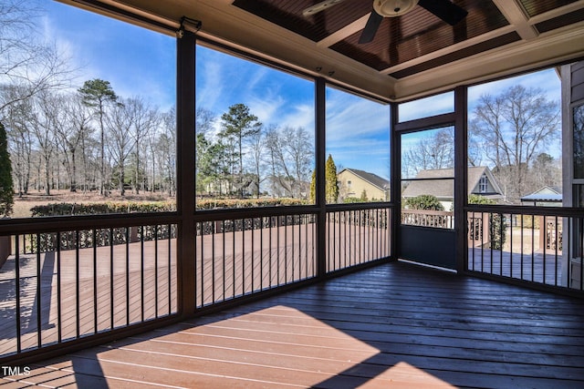 unfurnished sunroom with ceiling fan and coffered ceiling