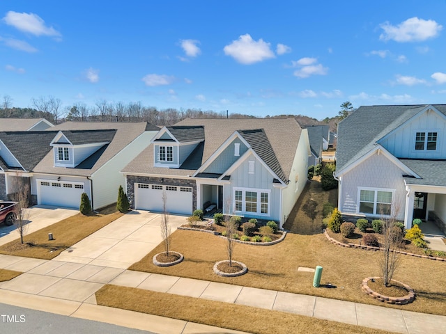 view of front of home with a residential view, board and batten siding, concrete driveway, and roof with shingles