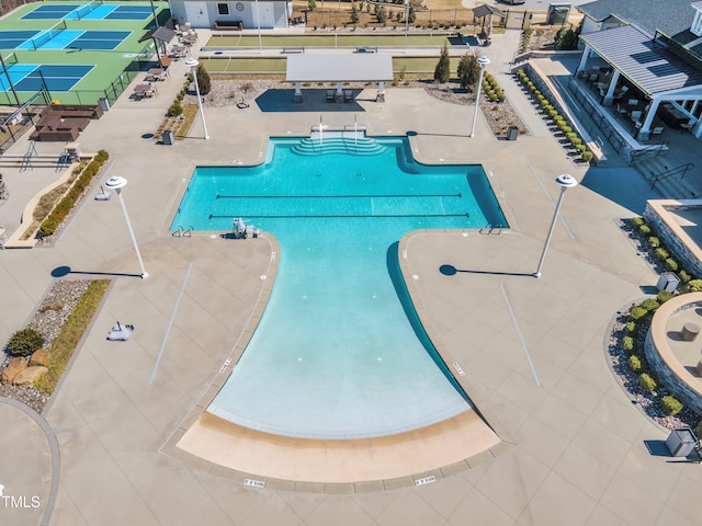 community pool featuring a patio area