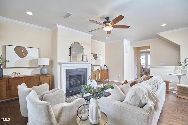 590 Grand Central Sta, Apex, NC 27502 - living area with wood finished floors, a ceiling fan, recessed lighting, a fireplace, and crown molding