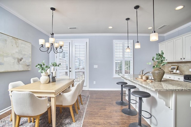 590 Grand Central Sta, Apex, NC 27502 - dining area featuring dark wood-style flooring, ornamental molding, a chandelier, and recessed lighting